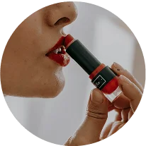 Woman applying lipstick